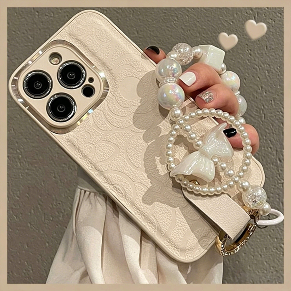 Pearl Charm Leather iPhone Case – Embossed Floral Design & Elegant Wrist Strap